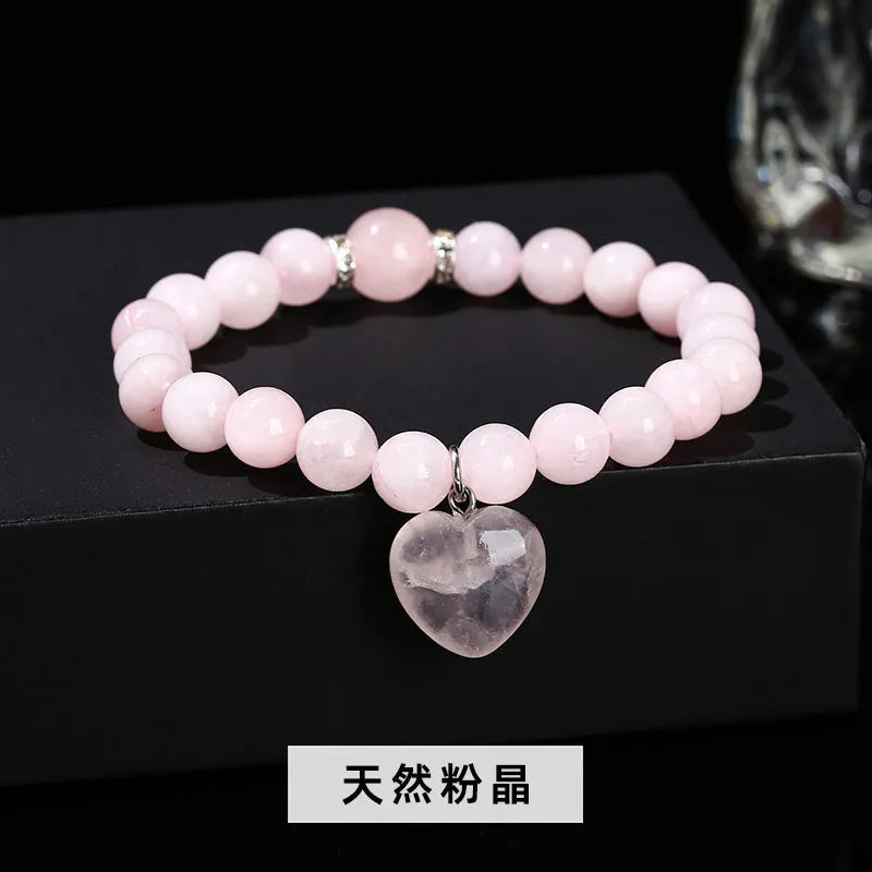 Handmade women's bracelet with natural gemstone beads and a silver love pendant charm.