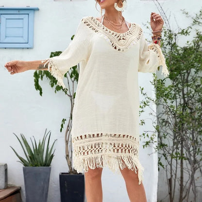 Apricot crocheted knitted patchwork beach dress with mid-length skirt and half sleeves on hanger