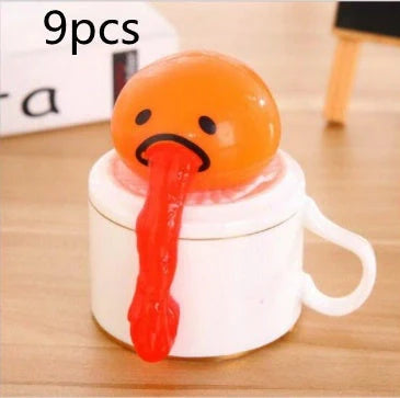 Gudetama Vomiting Egg Toy in green, orange, pink, and yellow for stress relief and fun