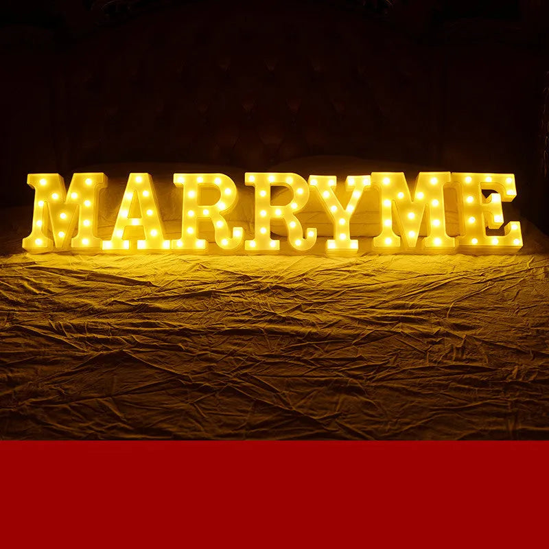 Plastic LED alphabet letter light spelling a message for a birthday or proposal.