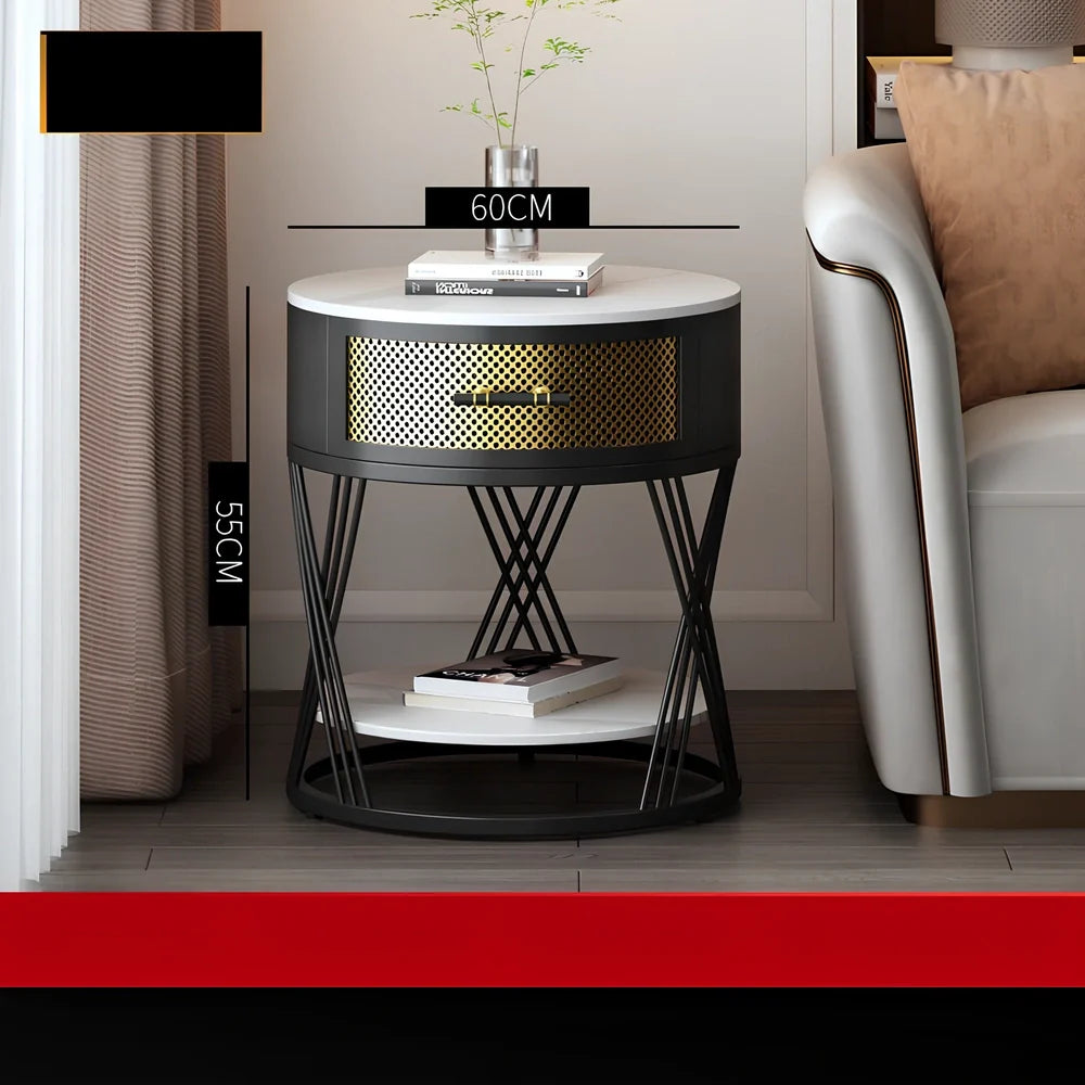 Round coffee table with slate surface and metal frame, featuring integrated storage compartment