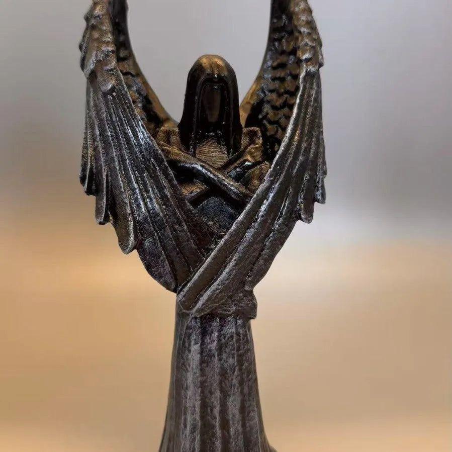 Dark Angel resin statue ornament measuring 6.5 by 5 by 17 centimetres on a wooden surface.