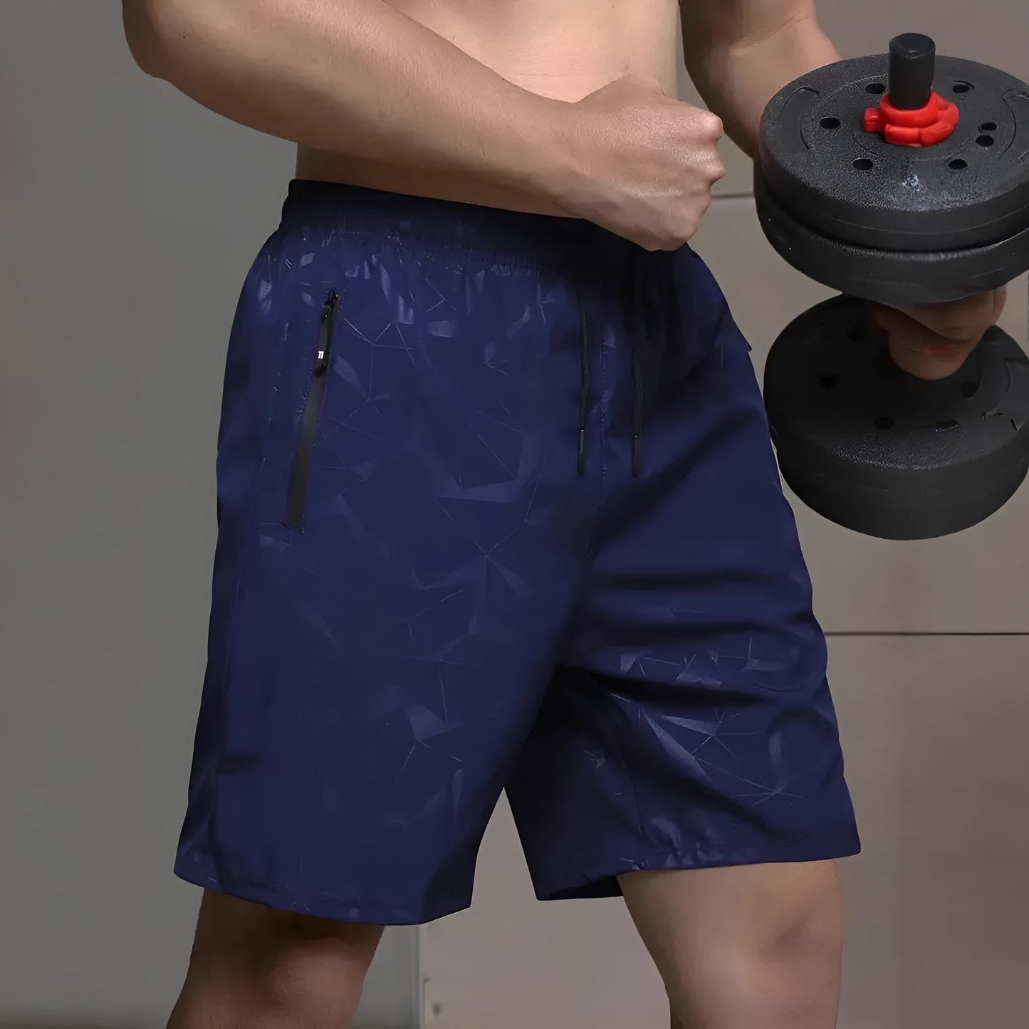 Men's loose-fit casual sports shorts in grey with a printed pattern, showing elastic waistband and fifth-pants length.