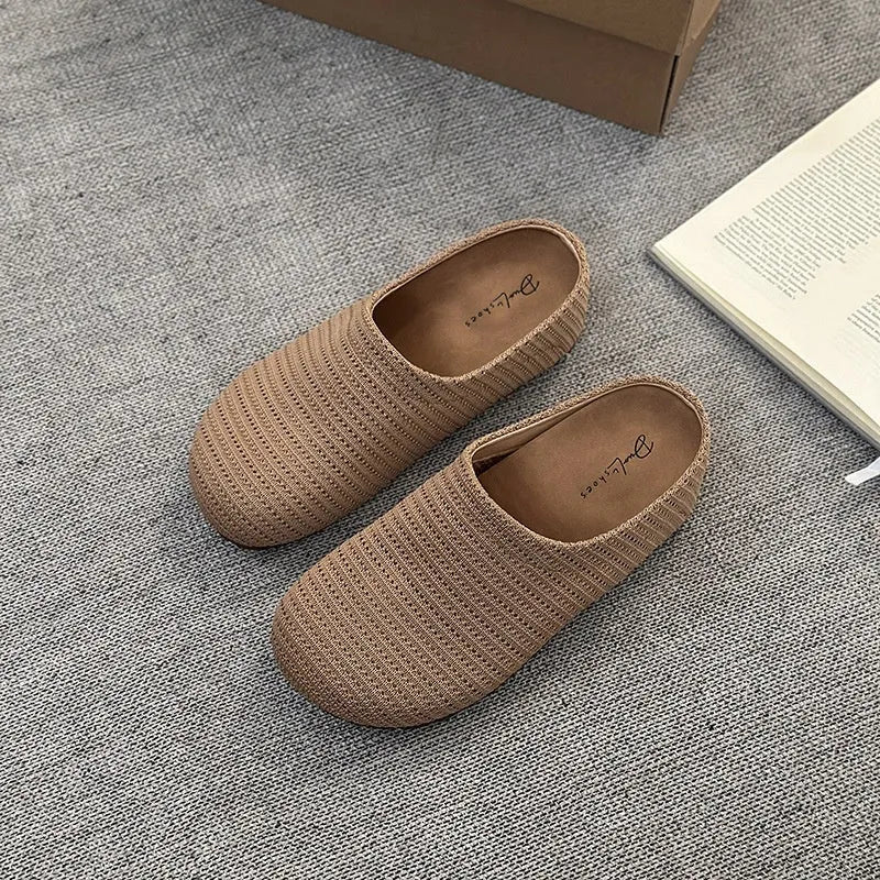 Women's non-slip cloth slippers with rubber sole in beige colour showing round toe design