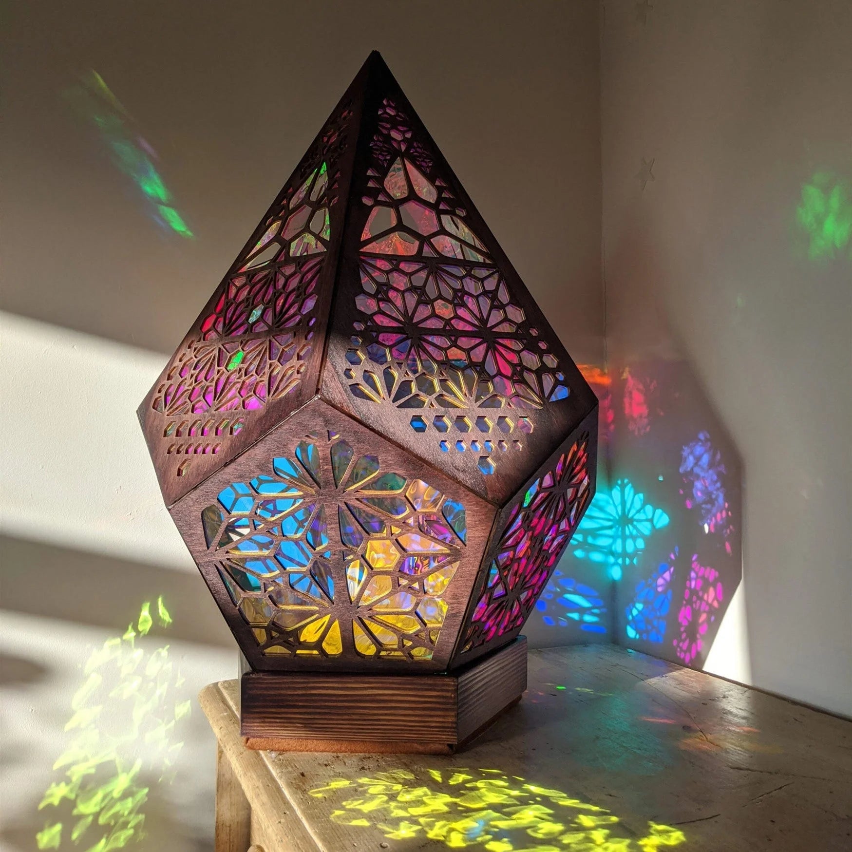 Bohemian Starry Sky Floor Lamp projecting vibrant colors on a wall