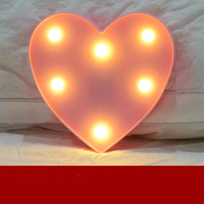 Plastic LED alphabet letter light spelling a message for a birthday or proposal.
