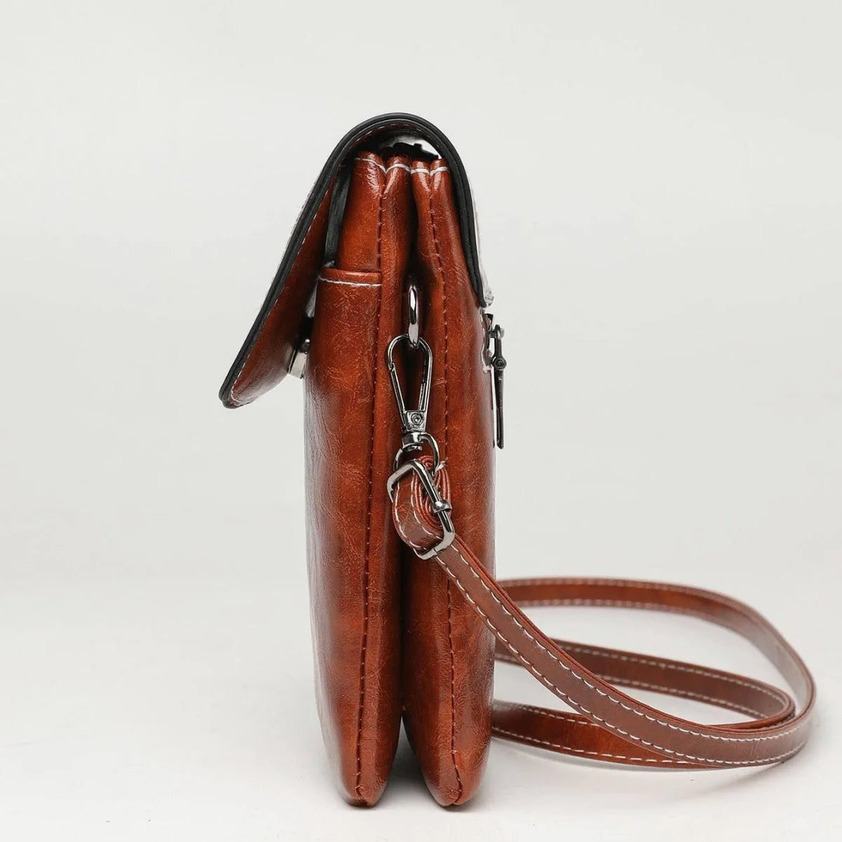 Stylish crossbody bag with mobile phone pocket, available in yellow, black, and brown colors
