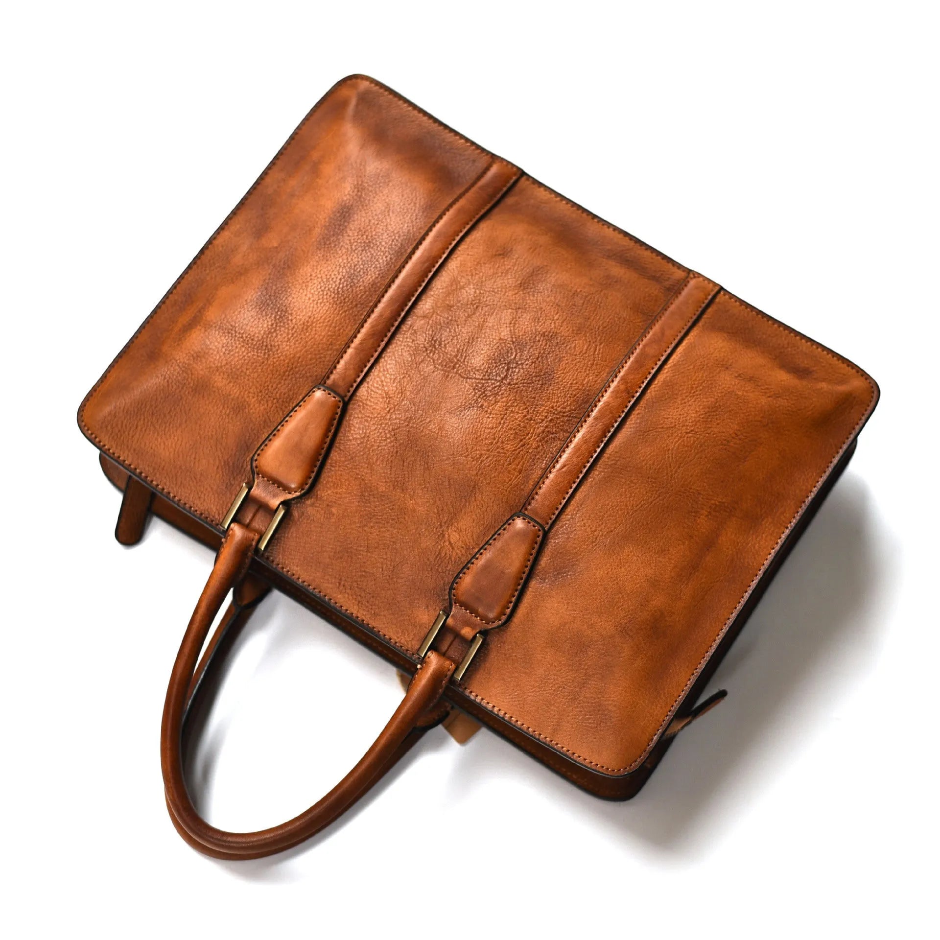 Khaki men's retro leather handbag with a horizontal square shape and top zipper, shown on a table.