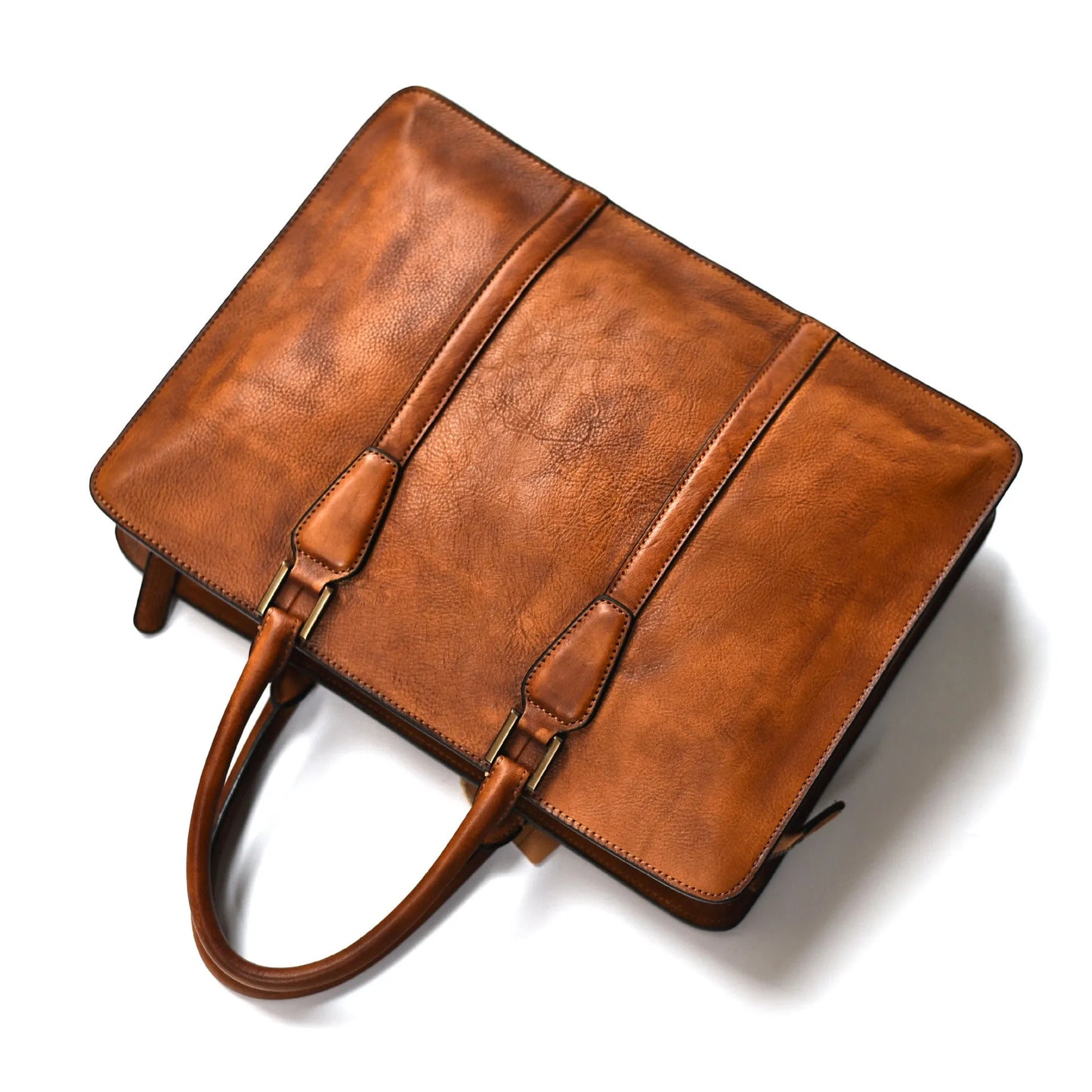 Men's khaki leather horizontal business handbag with front zipper, shown on a table.