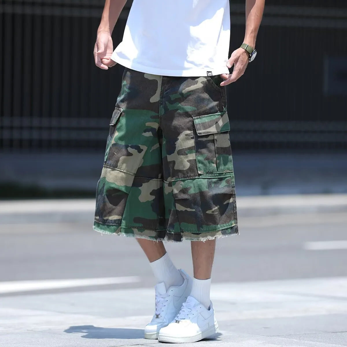American-style loose-fit camouflage shorts in a cropped length on a neutral background.