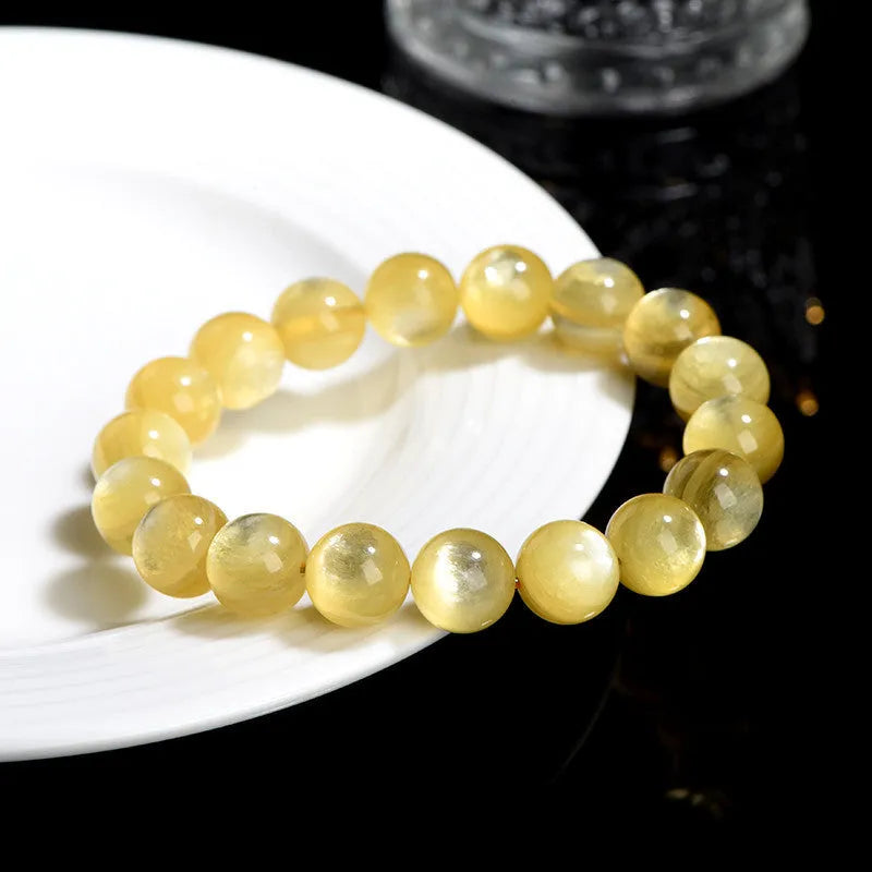 Yellow golden dragon mica round beads bracelet with polished lepidolite gemstones.