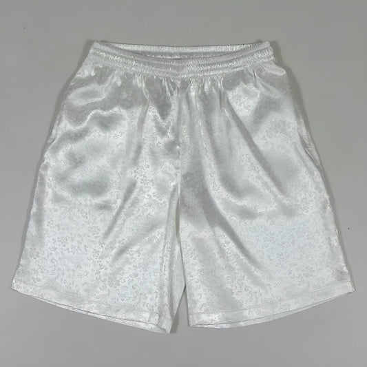Men's black Tai Chi shorts with a white drawstring elastic waistband laid flat.