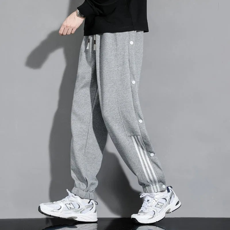 Men's loose fit ankle-tied sweatpants in a cotton blend fabric on a neutral background
