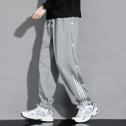 Men's loose fit ankle-tied sweatpants in a cotton blend fabric on a neutral background