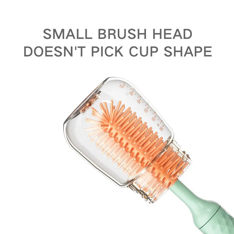 Electric baby bottle cleaning brush with rotating silicone head in pink or green colours