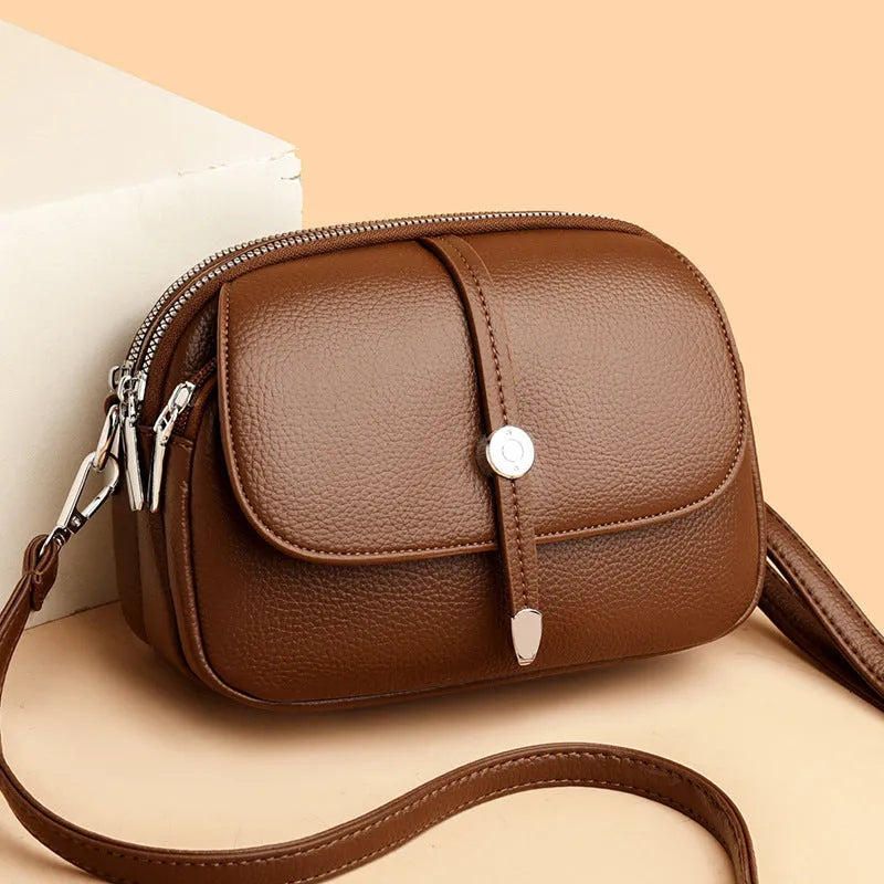 City Simple women's oval-shaped soft PU crossbody shoulder bag in black, khaki, or dark brown