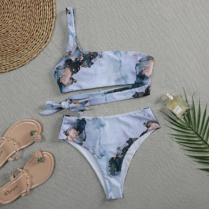 Women's high-waist bikini set with U-neck top in a blue marble tie-dye print.