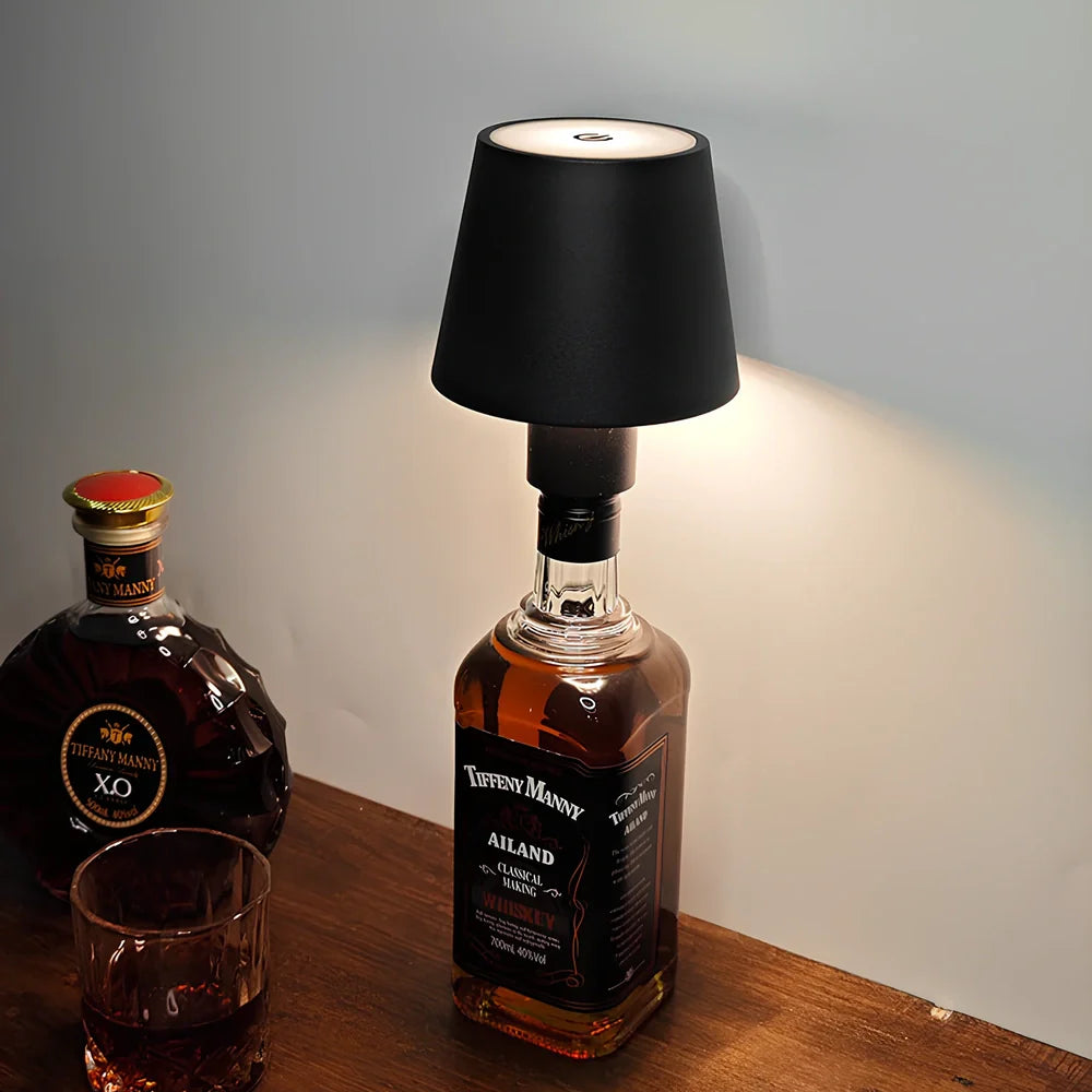 Wireless wine bottle lamp with USB charging cable in black aluminium finish showing LED illumination