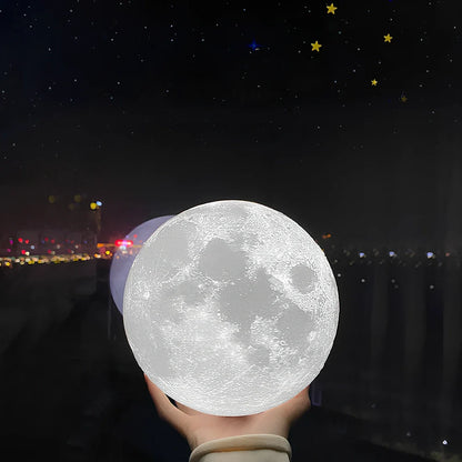 3D-printed moon night table lamp with remote control on wooden holder, showing lunar texture and adjustable brightness aperture