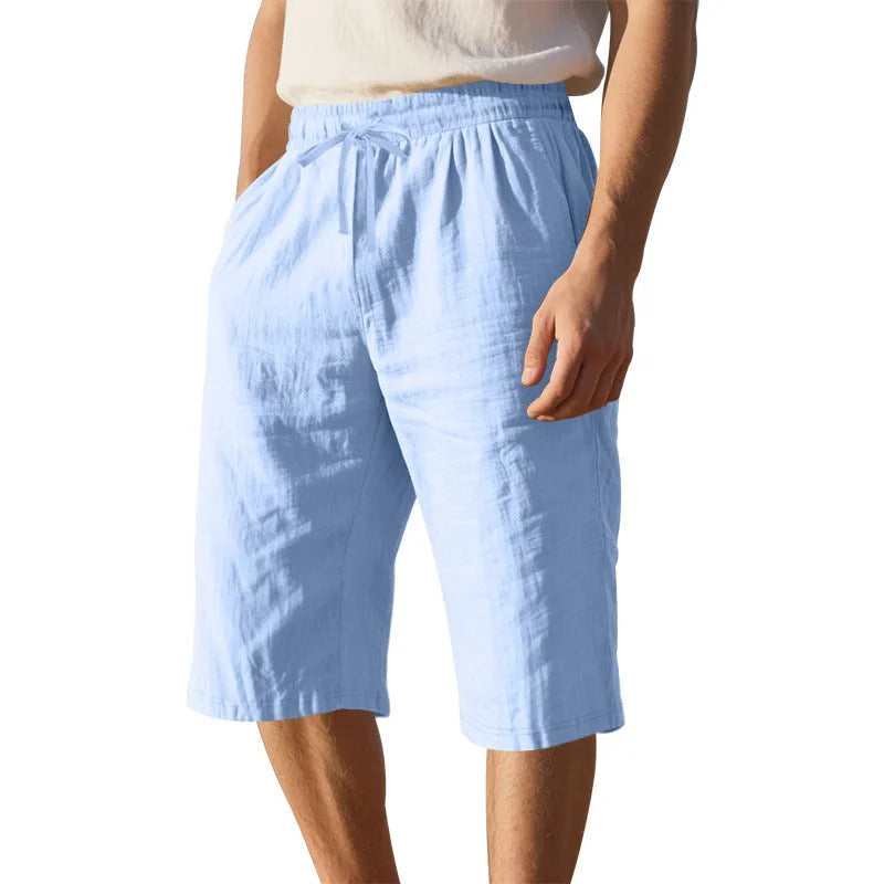 Men's linen shorts in light blue with drawstring waist and cropped straight-leg design