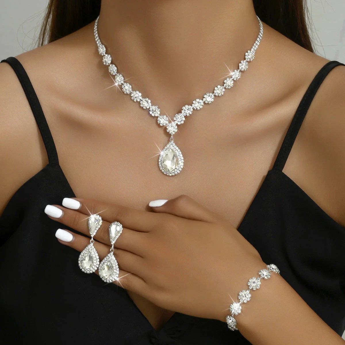 Elegant bridal jewelry set with necklace, earrings, and bracelet in various colors including white, blue, red, and green