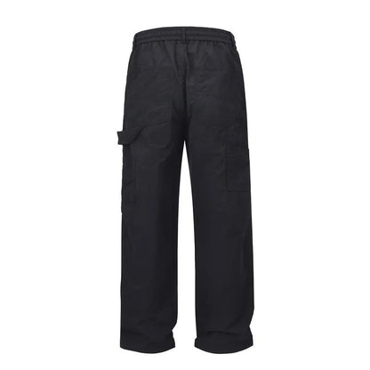 Black tooling paratrooper pants with elastic waist drawstring closure and baggy three-dimensional cutting