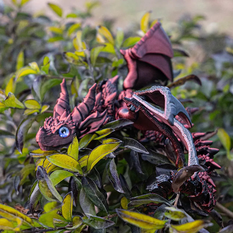 Red and gold 3D printed plastic dragon wings decoration for costumes.