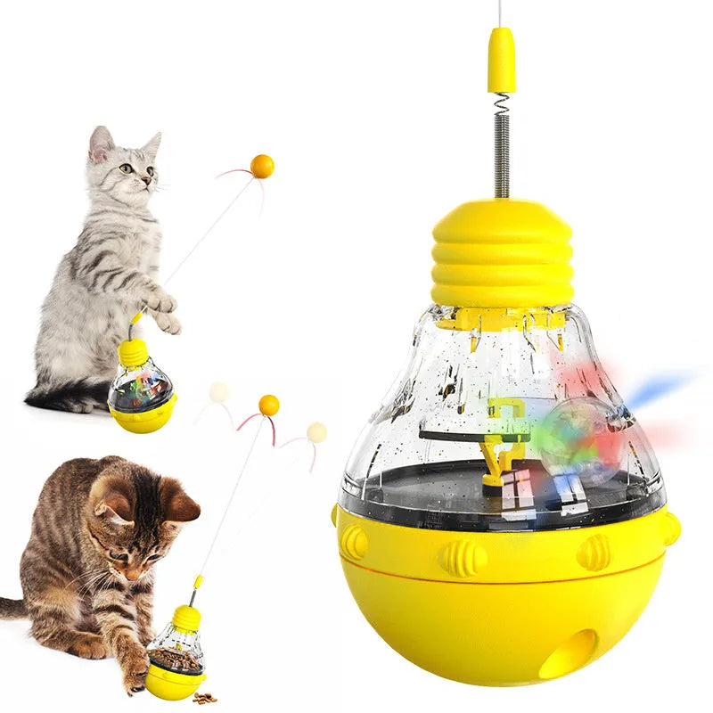 Multi-functional cat toy with tilting base, teaser wand with ball and ribbon, and food dispenser opening