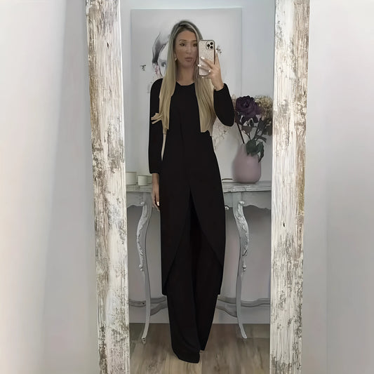 Casual black polyester two-piece lounge set with long sleeves and loose fit trousers on a hanger.