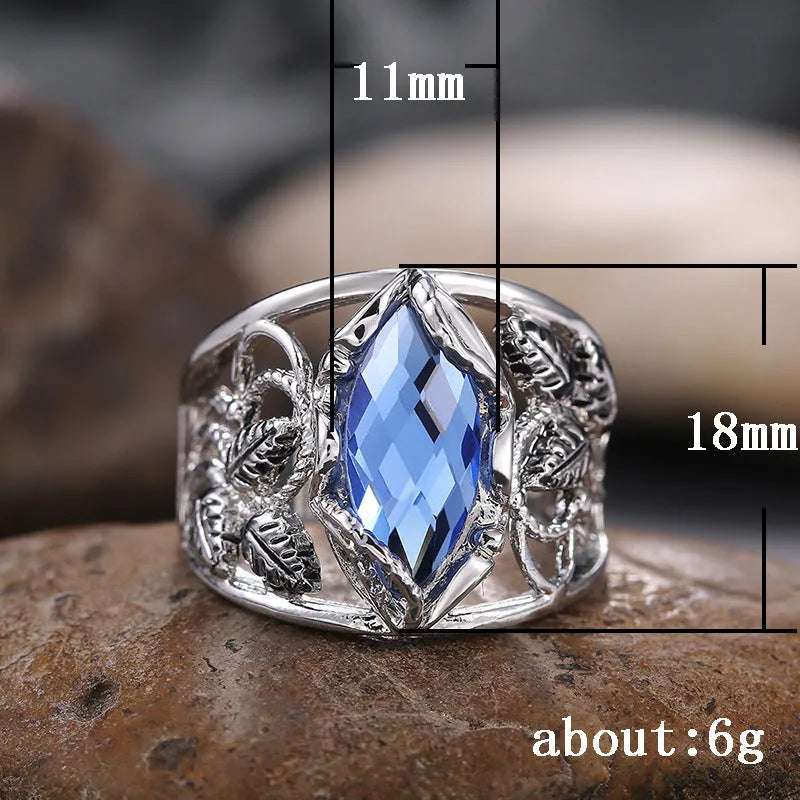 Blue horse eye-shaped women's alloy ring with crystal inlay on a white background.