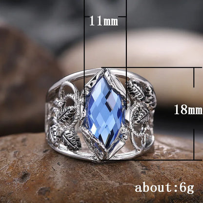 Blue horse eye-shaped women's alloy ring with crystal inlay on a white background.
