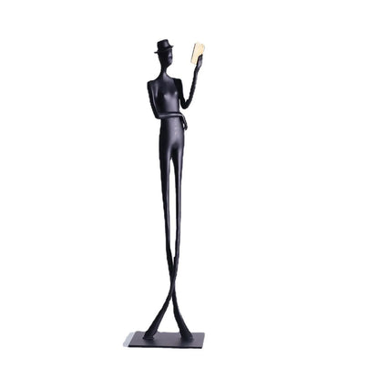 Black cast aluminium desktop sculpture of reading woman measuring 12x12x51cm with modern simplicity design