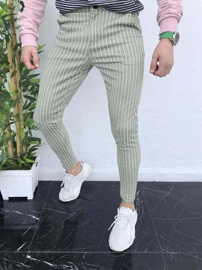 Man wearing slim-fit straight-leg plaid trousers with a 3D printed pattern and a casual shirt.