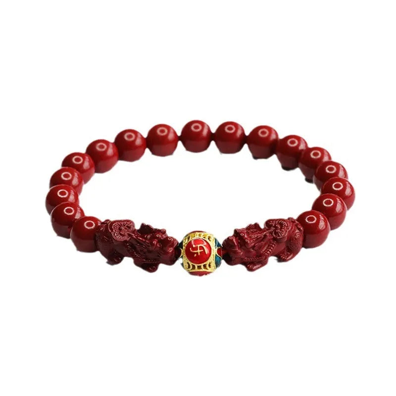 Purple gold sand cinnabar bracelet with carved double Pixiu design, 8mm beads.