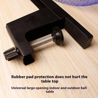 Table tennis post with universal large clip attached to indoor open grid table for ball retrieval practice