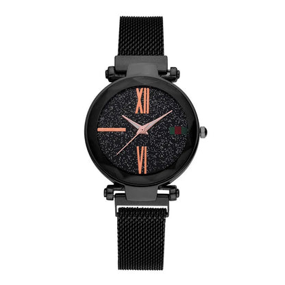 Rose gold ladies watch with round 32mm dial and magnetic stainless steel jewellery clasp on wrist.