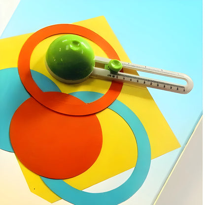 Green and orange plastic round paper cutter for office use, capable of cutting A3 sheets.