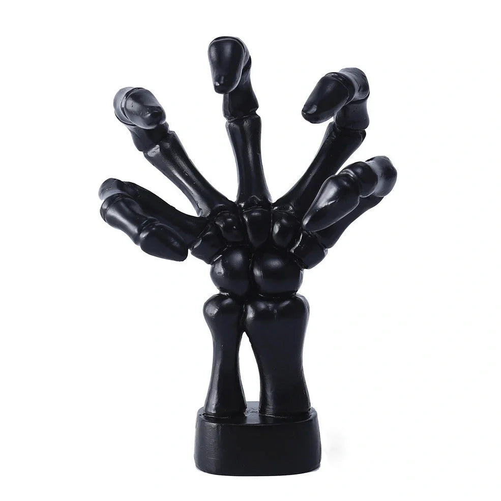 Black skeleton hand wall hook with articulated fingers for hanging keys and jewellery