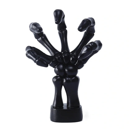 Black skeleton hand wall hook with articulated fingers for hanging keys and jewellery