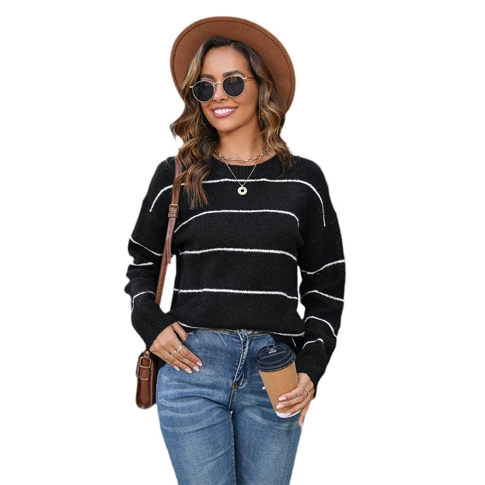 Women's white and black striped pullover sweater with round neck and loose fit