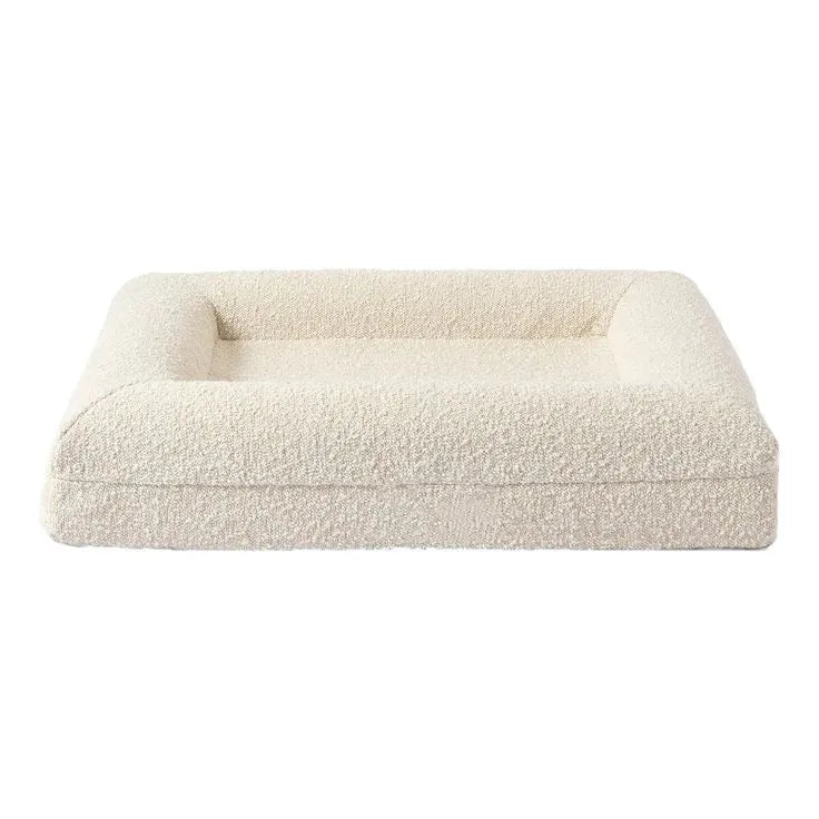 Beige rectangular cloth dog bed sofa nest with raised sides showing four size options