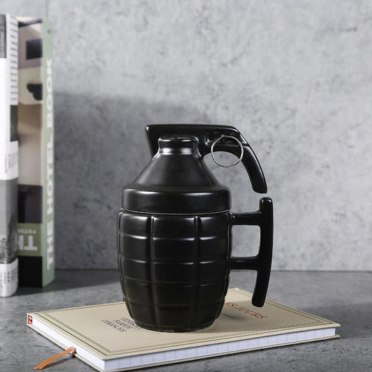 A white or black ceramic coffee mug with a grenade-inspired design and a secure lid for on-the-go convenience.