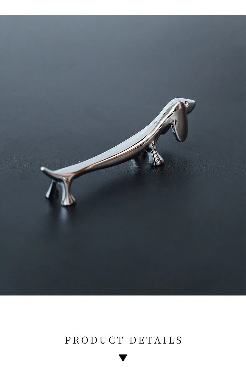 Silver sausage dog chopstick rest and cutlery holder made from zinc alloy with coating for chopsticks, knives or forks