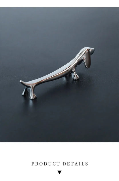 Silver sausage dog chopstick rest and cutlery holder made from zinc alloy with coating for chopsticks, knives or forks