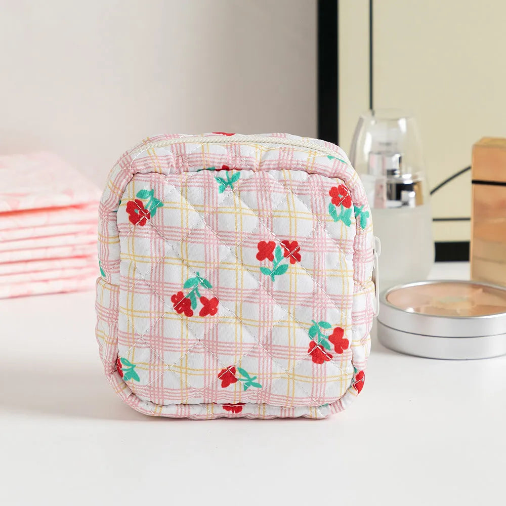 Women's key storage bag with floral patterns including cherry on white background design
