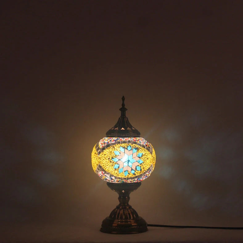 Glass table lamp with 150mm diameter shade and 330cm cord on wooden surface