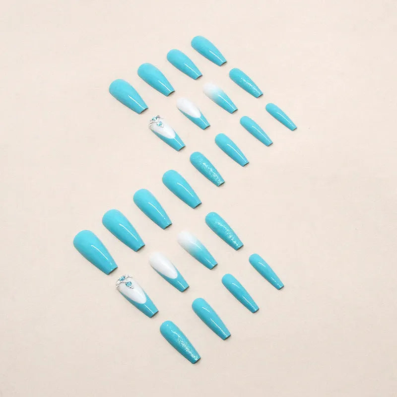 Solid colour long ballet false nails with diamond accents, a 24-piece set in smart blue featuring a wearable length and shape for easy, glue-on application.
