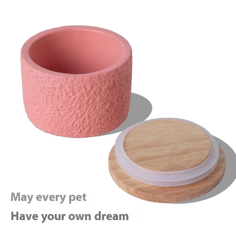 Handmade cement cinerary casket for pet ashes in six colours: black, grey, green, pink, white, yellow