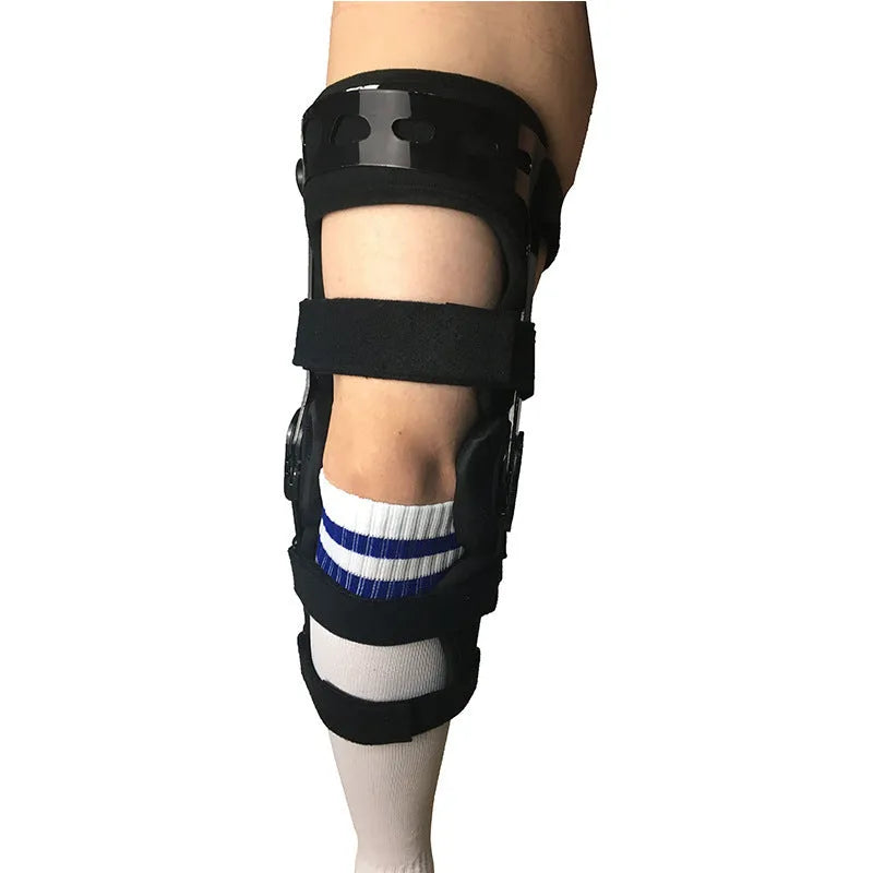 Black anterior ligament knee support brace with dual adjustable straps, shown on a knee.