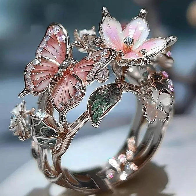 Adjustable crystal butterfly flower ring in gold, silver, and rose gold finishes